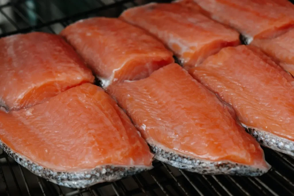 Brined salmon air-drying on a rack to form a pellicle
